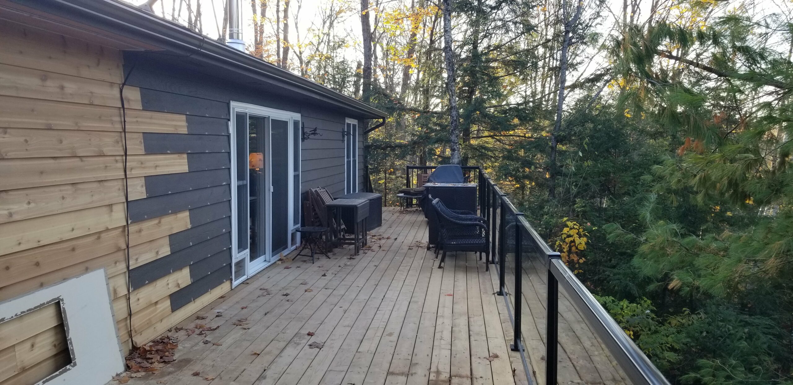 New deck installation with glass railings